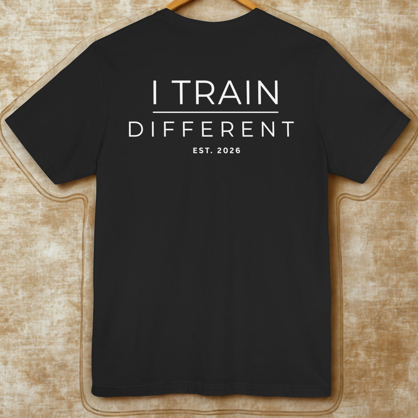I Train Different Tee — Motivational Fitness T-Shirt (Est. 2026)
